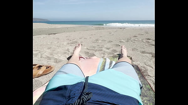 Teen jerks off on public beach